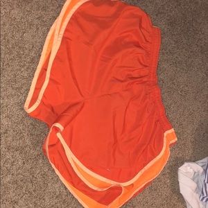 Orange Nike shorts